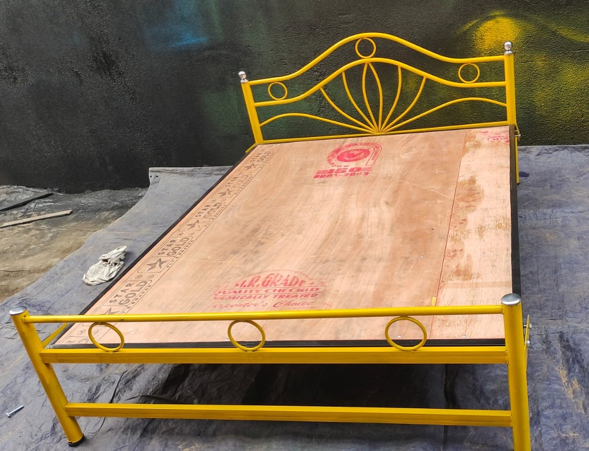 Finished yellow steel cot ready for delivery